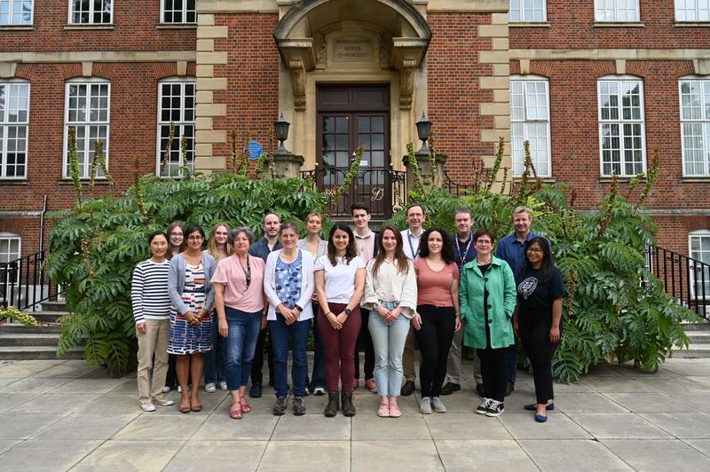 The Maiden Lab Group, June 2022. The group has around 20 members and is stood in front of the Sir William Dunn School of Pathology, Oxford, the building in which we are based. 